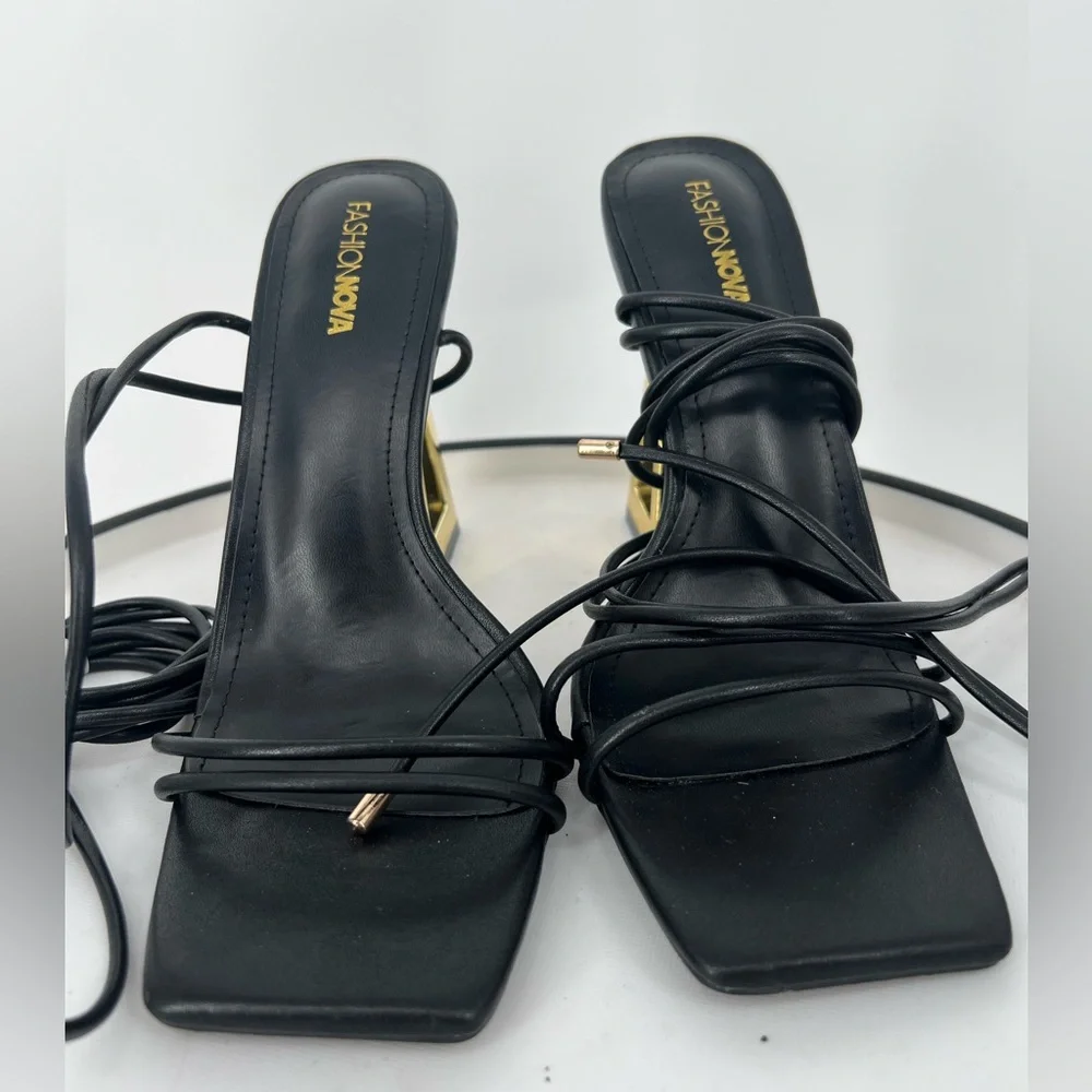 FASHION NOVA STAY WINNING WRAP UP HEELS ‎ IN BLACK GOLD NOVELTY HEELS
